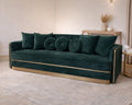 Dark Green Velvet Sofa – Deep green velvet sofa with gold base detailing.